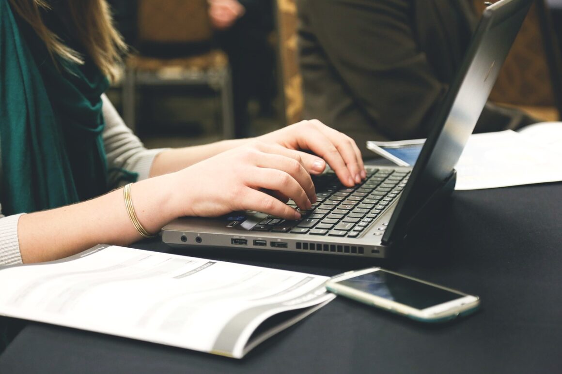 Woman working at a contemporary desk set-up.